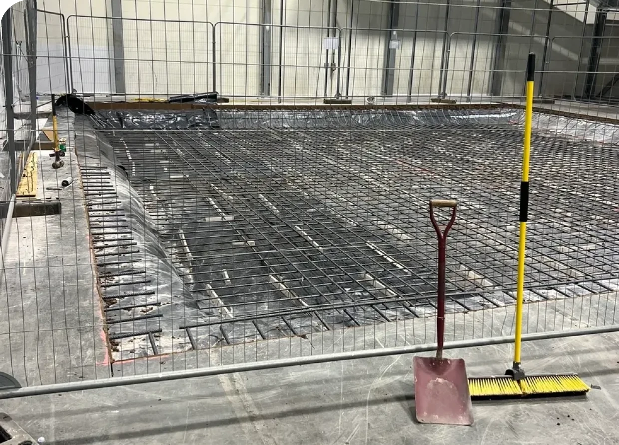 Construction site with rebar and tools